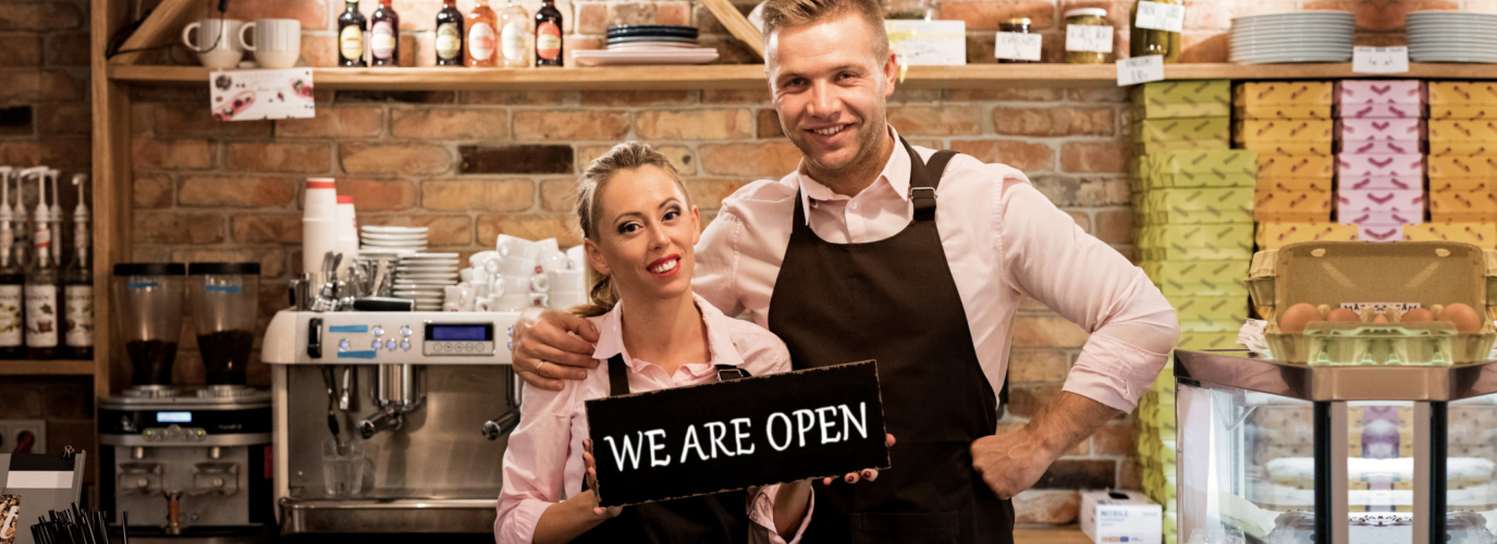 Couple In Their New Cafe Proud News Business Owners